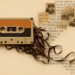 A vintage cassette tape unravels into a stream of binary code, faded photographs, and handwritten fragments—symbolizing emotional memory as a blend of analog nostalgia and digital echo.